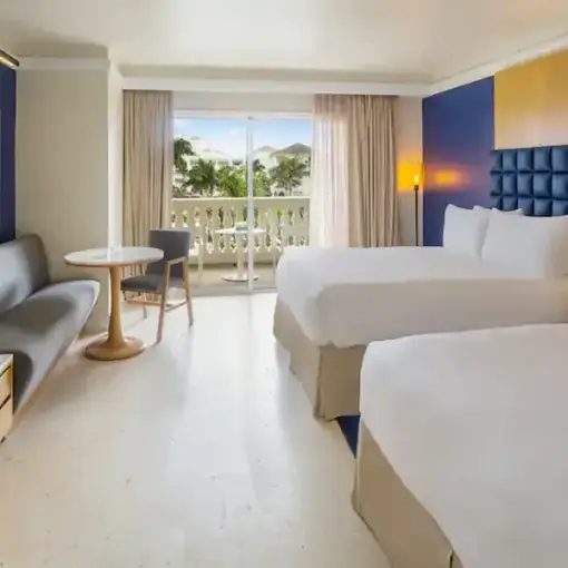 Modern suite with two beds and a private balcony at Hyatt Zilara Rose Hall, Montego Bay