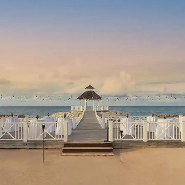 Ocean gazebo wedding reception setup with high-top tables at Hyatt Zilara Rose Hall, Montego Bay