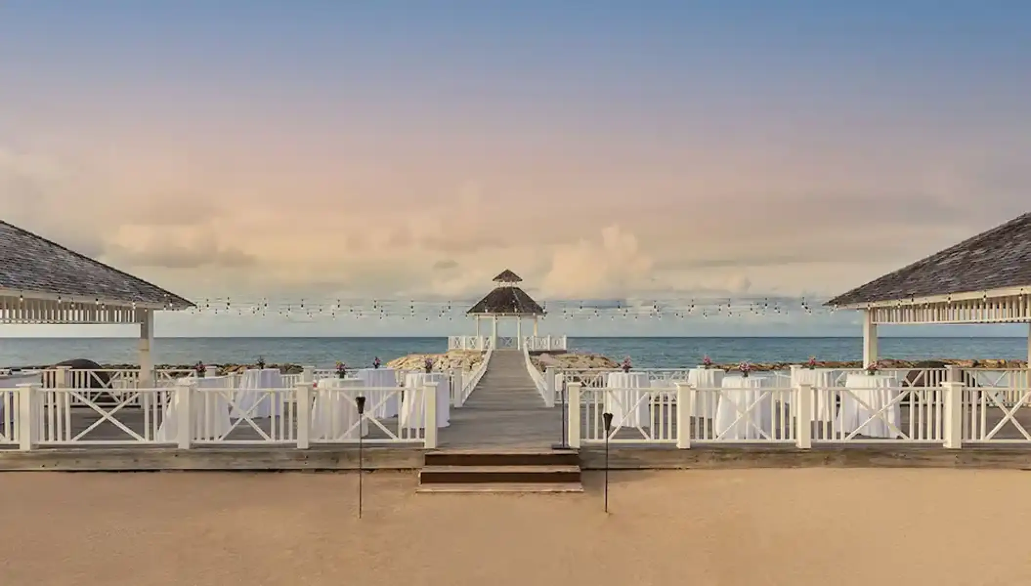 Ocean gazebo wedding reception setup with high-top tables at Hyatt Zilara Rose Hall, Montego Bay