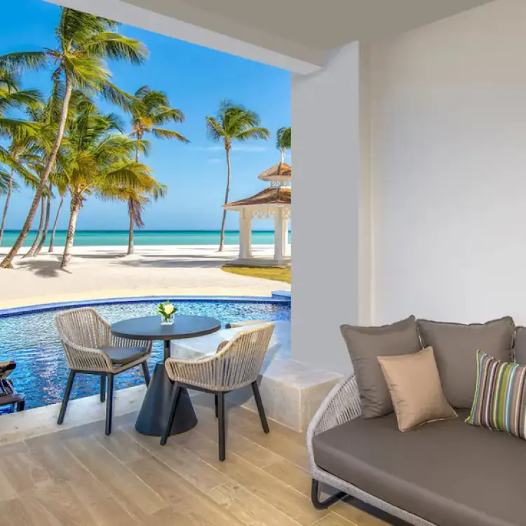 Oceanfront junior suite swim-up patio with seating at Hyatt Ziva Cap Cana, Punta Cana