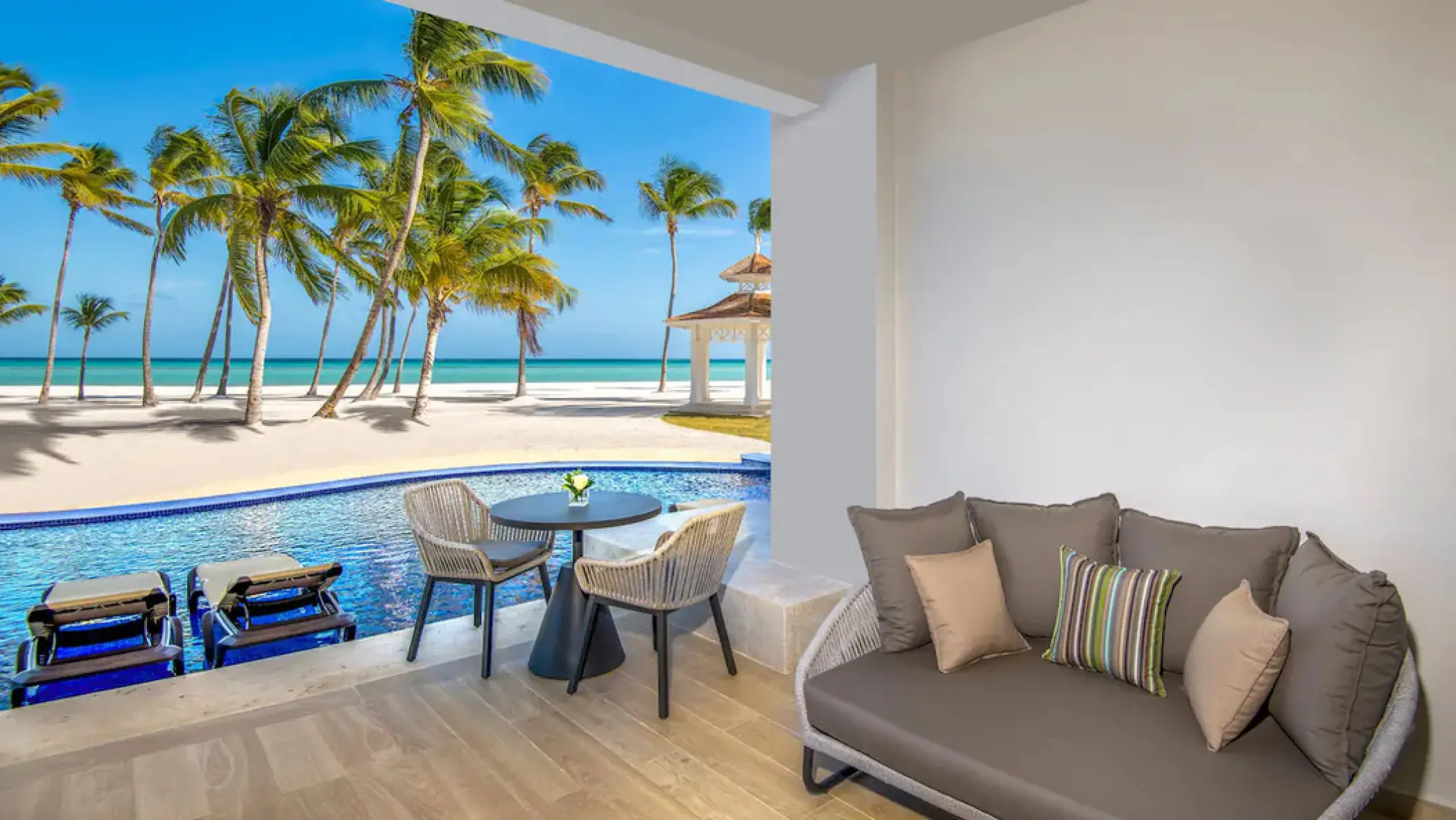 Oceanfront junior suite swim-up patio with seating at Hyatt Ziva Cap Cana, Punta Cana