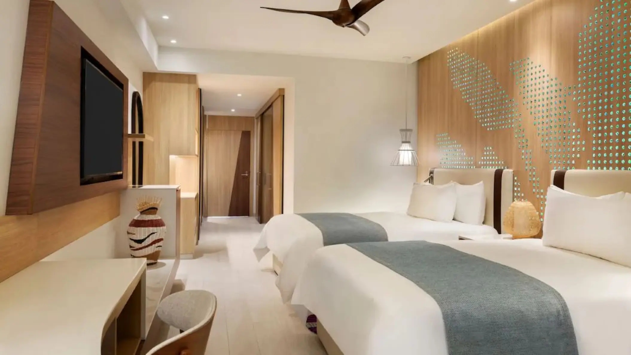 Junior Double Suite with two beds and modern wood accents at Hyatt Ziva Cap Cana, Punta Cana
