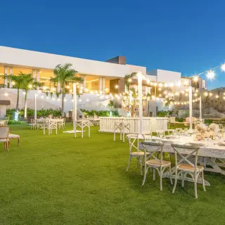 Evening lawn wedding reception with string lights at Hyatt Ziva Cap Cana, Punta Cana