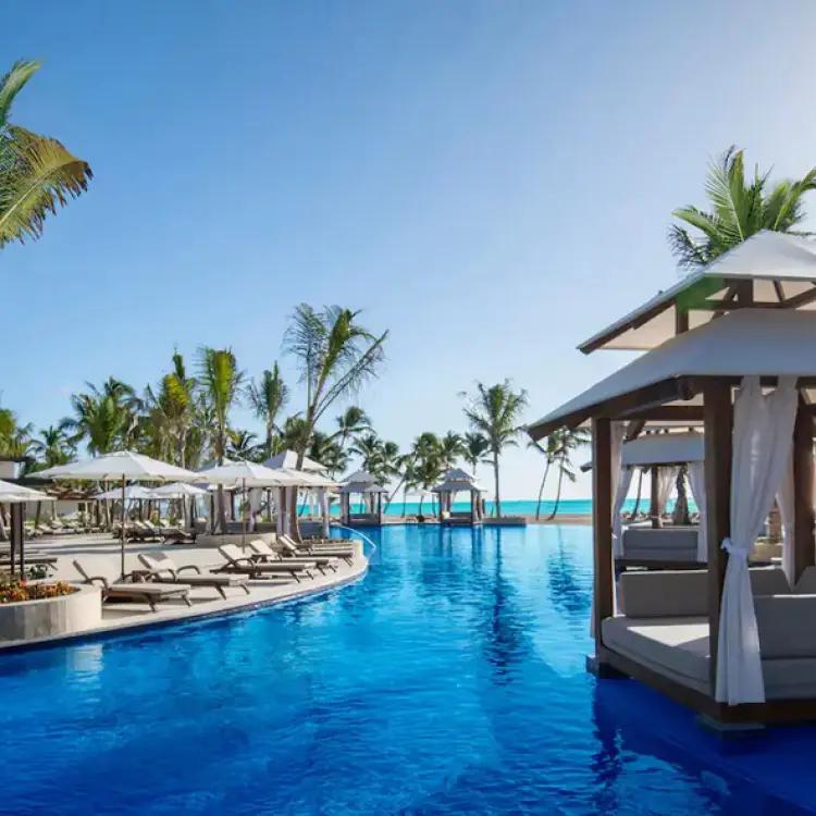 Hyatt Ziva Cap Cana main pool with floating cabanas and palm trees, Punta Cana
