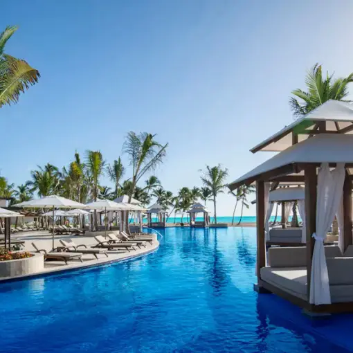 Hyatt Ziva Cap Cana main pool with floating cabanas and palm trees, Punta Cana