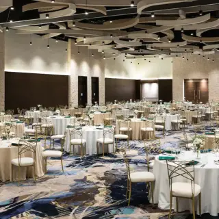 Santo Domingo ballroom wedding reception setup with circular tables at Hyatt Ziva Cap Cana, Punta Cana