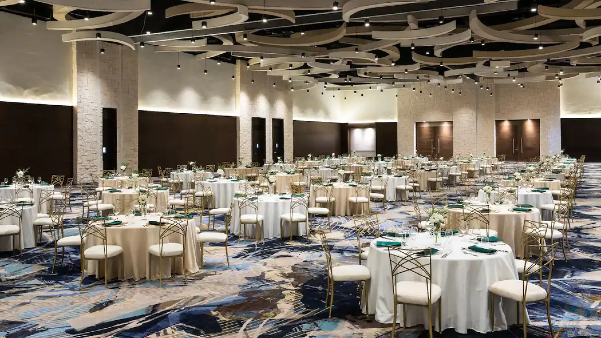 Santo Domingo ballroom wedding reception setup with circular tables at Hyatt Ziva Cap Cana, Punta Cana