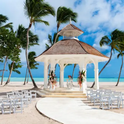 Beachfront wedding ceremony gazebo with white seating at Hyatt Ziva Cap Cana, Punta Cana