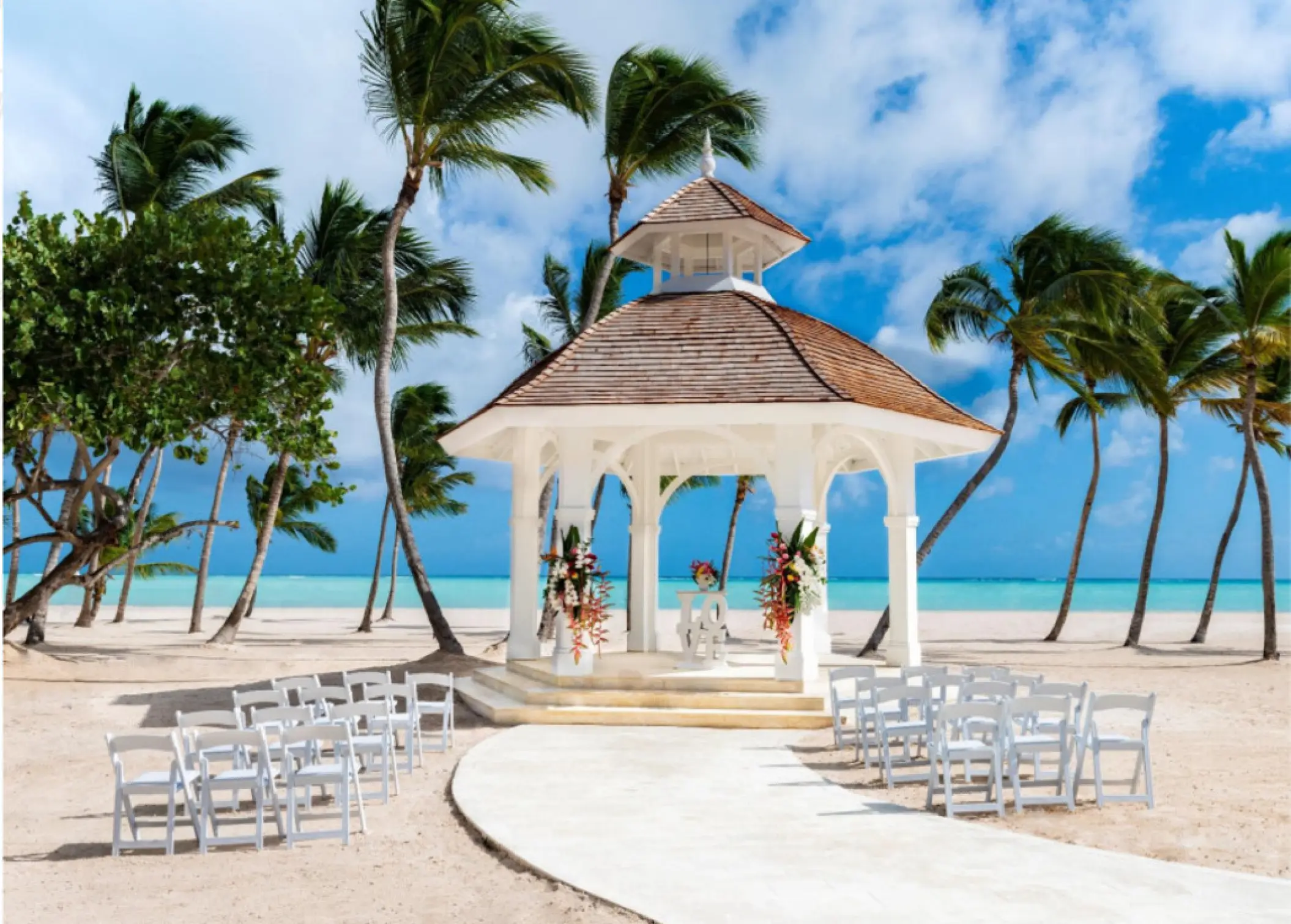 Beachfront wedding ceremony gazebo with white seating at Hyatt Ziva Cap Cana, Punta Cana