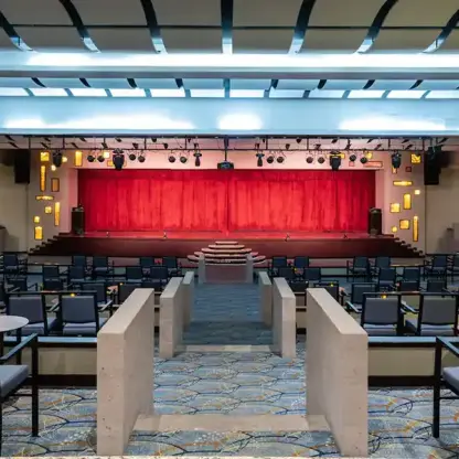 Grand theater with red curtains and tiered seating at Hyatt Ziva Los Cabos, Cabo San Lucas