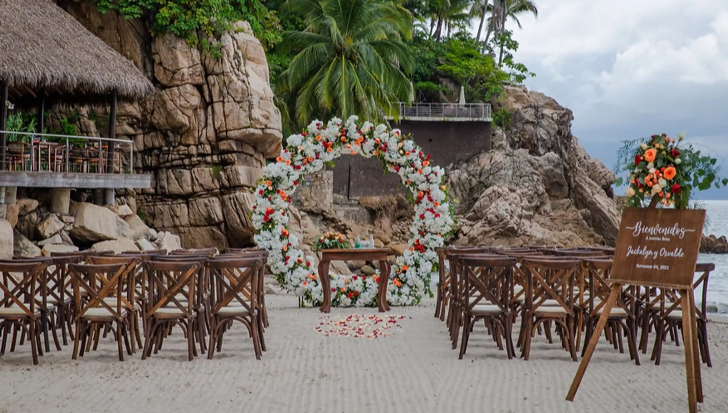 Circular floral arch for a beach ceremony at Hyatt Ziva Puerto Vallarta, Puerto Vallarta