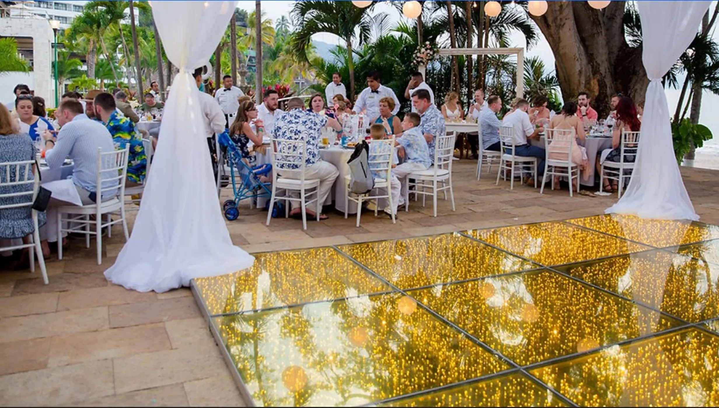 Las Palmas Terrace wedding reception with a gold dance floor at Hyatt Ziva Puerto Vallarta