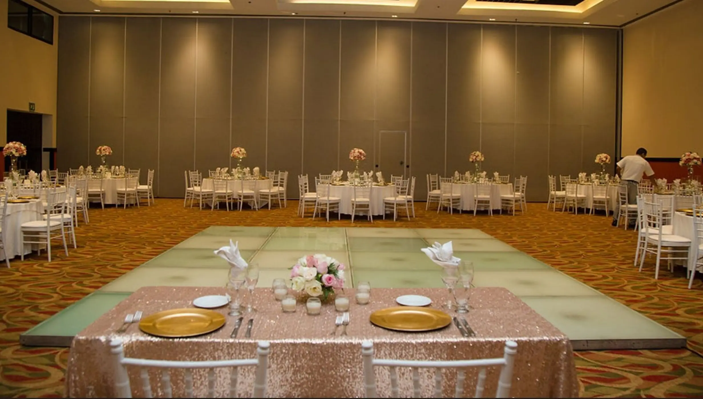 Indoor wedding reception setup with dance floor and head table at Hyatt Ziva Puerto Vallarta