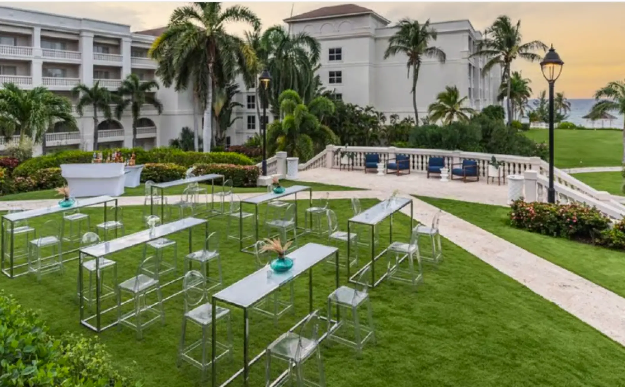 Lawn wedding reception setup with modern high-top tables at Hyatt Ziva Rose Hall, Montego Bay