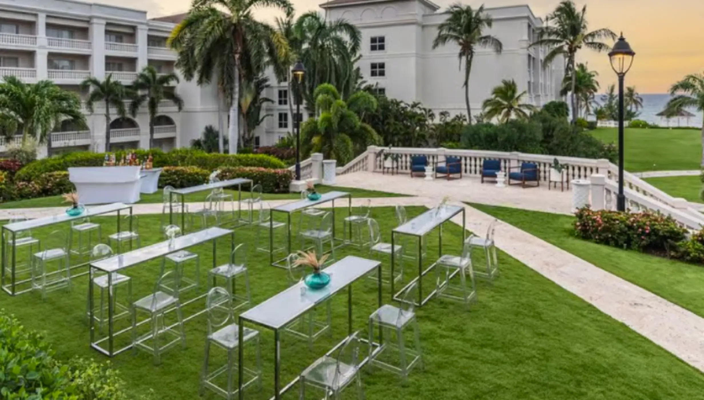 Lawn wedding reception setup with modern high-top tables at Hyatt Ziva Rose Hall, Montego Bay