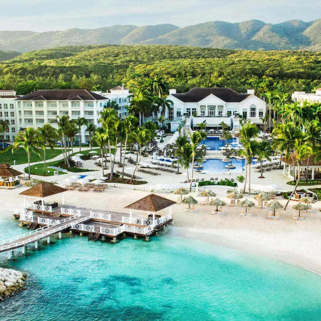 Aerial view of Hyatt Ziva Rose Hall buildings, beach, and turquoise water, Montego Bay