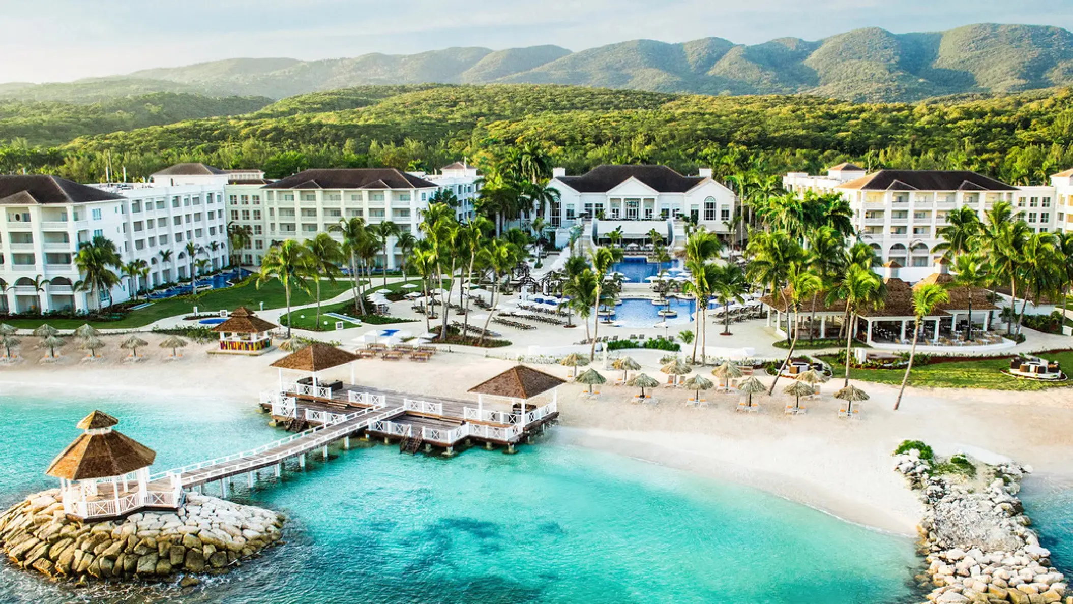 Aerial view of Hyatt Ziva Rose Hall buildings, beach, and turquoise water, Montego Bay