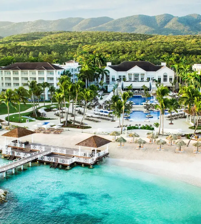 Aerial view of Hyatt Ziva Rose Hall buildings, beach, and turquoise water, Montego Bay