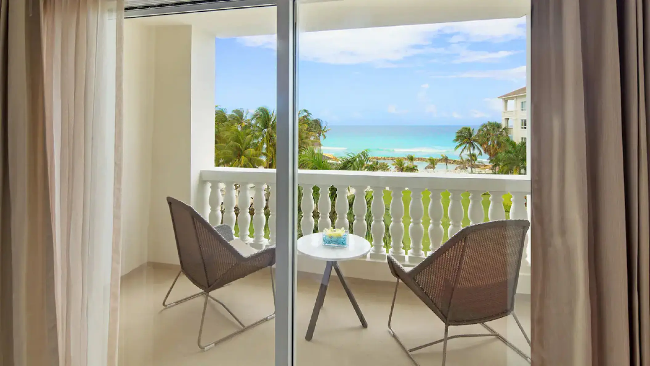 Private guest room balcony with ocean views at Hyatt Ziva Rose Hall, Montego Bay