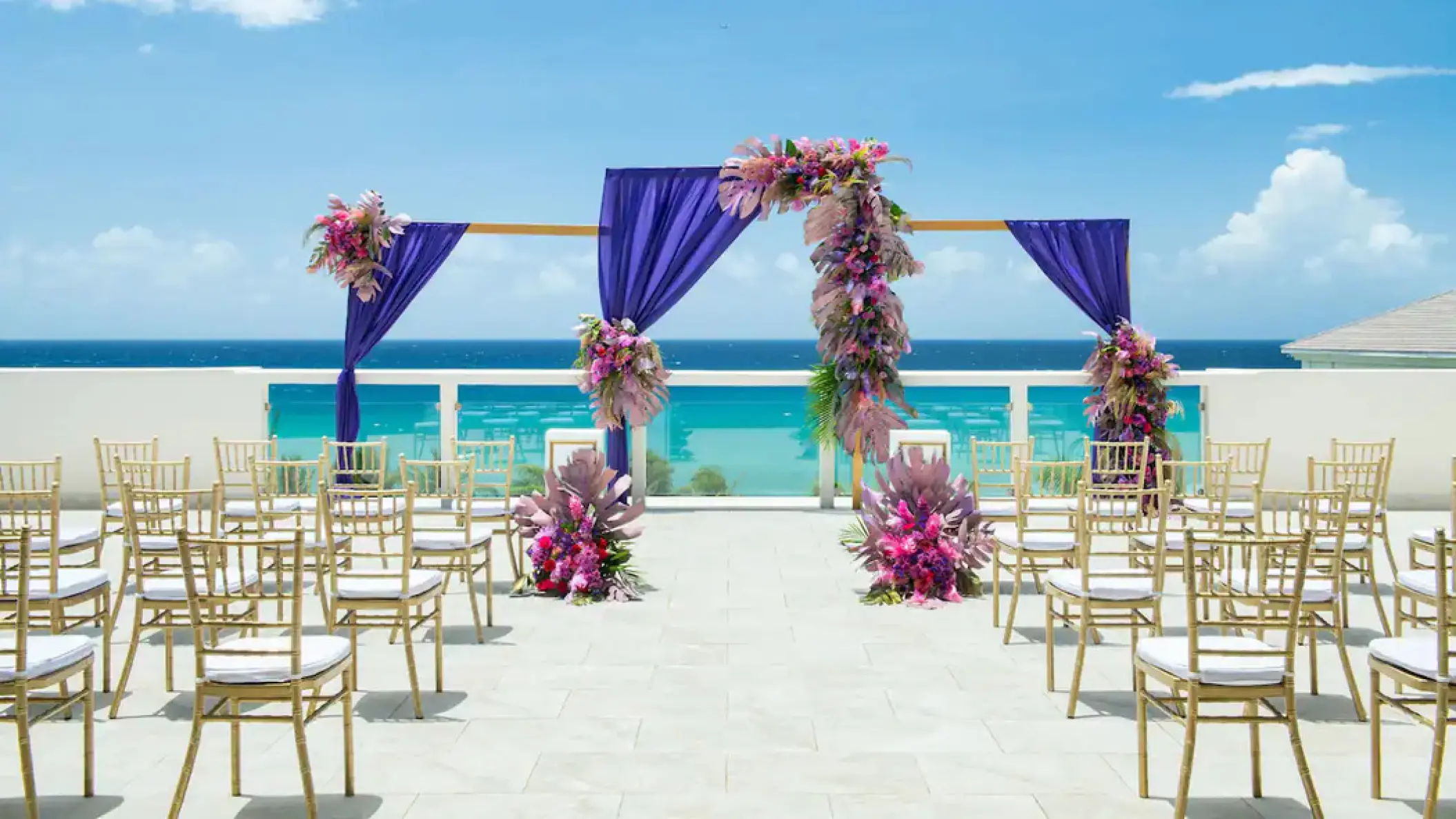 Sky lounge wedding ceremony setup with purple drapes at Hyatt Ziva Rose Hall, Montego Bay