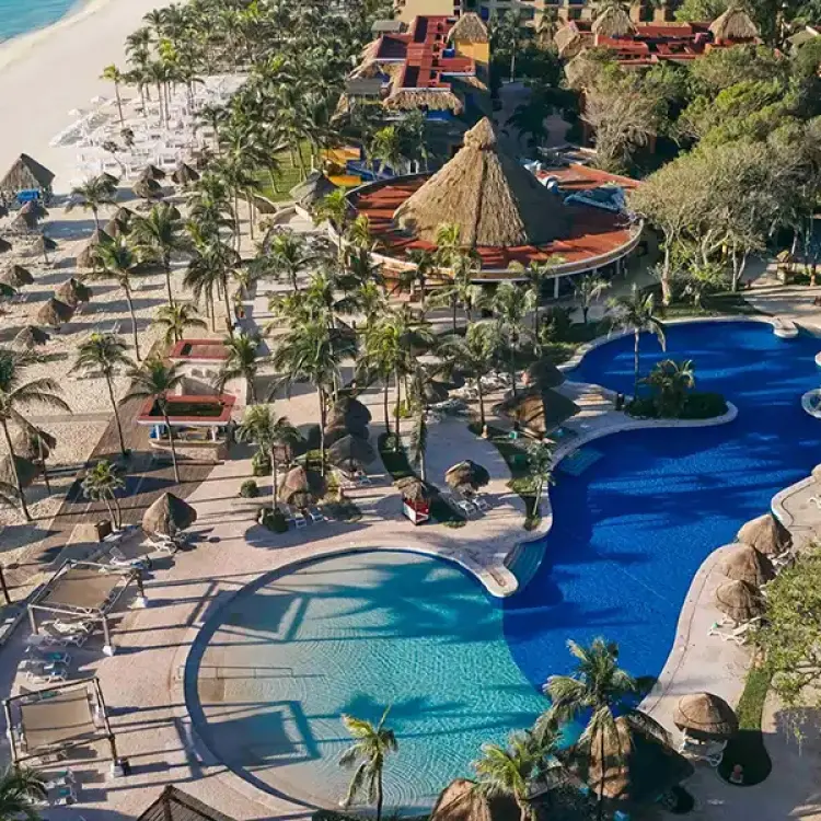 Aerial view of swimming pools and white sand beach at Iberostar Waves Quetzal, Playa Del Carmen