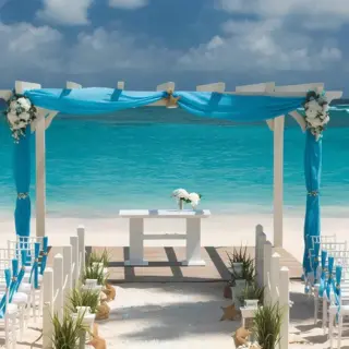 Beachfront wedding ceremony setup with turquoise drapery at Iberostar Selection Bavaro, Punta Cana