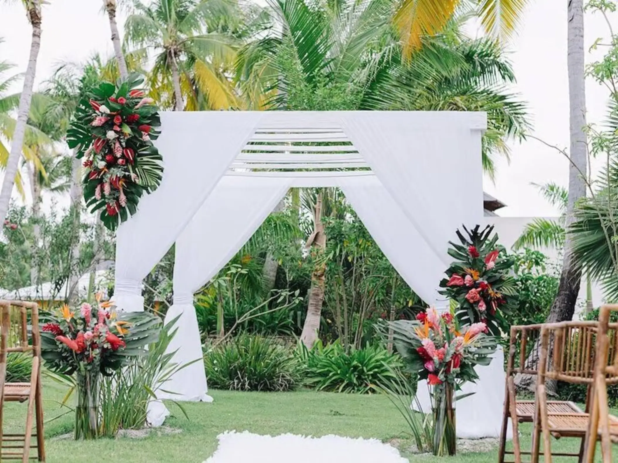 Garden wedding ceremony arch with tropical flowers at Iberostar Selection Bavaro, Punta Cana