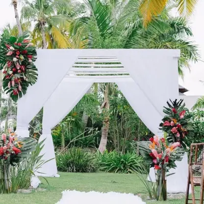 Garden wedding ceremony arch with tropical flowers at Iberostar Selection Bavaro, Punta Cana