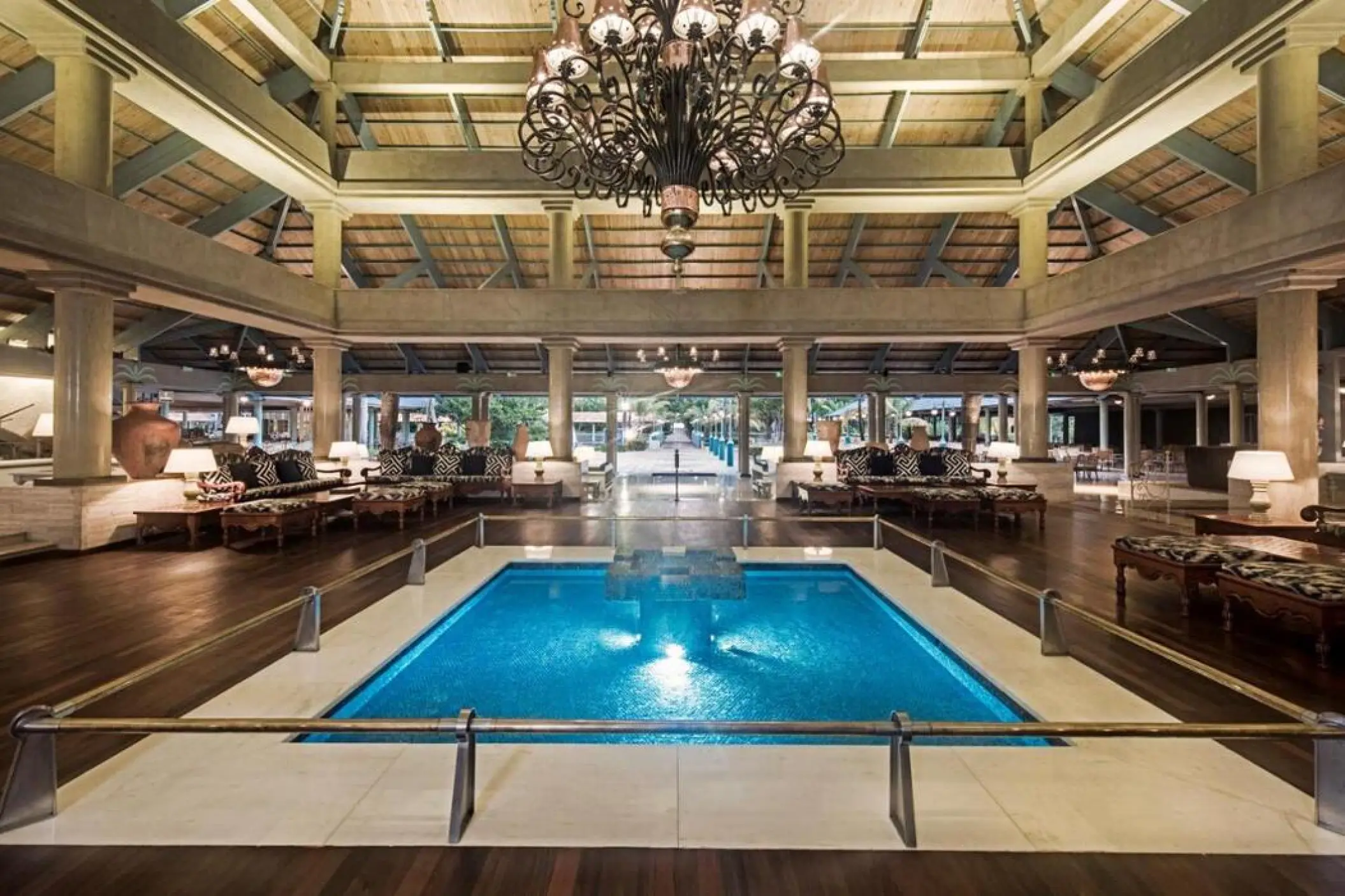 Indoor courtyard and fountain under a grand chandelier at Iberostar Selection Bavaro, Punta Cana
