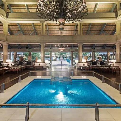 Iberostar Selection Bavaro lobby with an indoor pool and wrought iron chandelier, Punta Cana