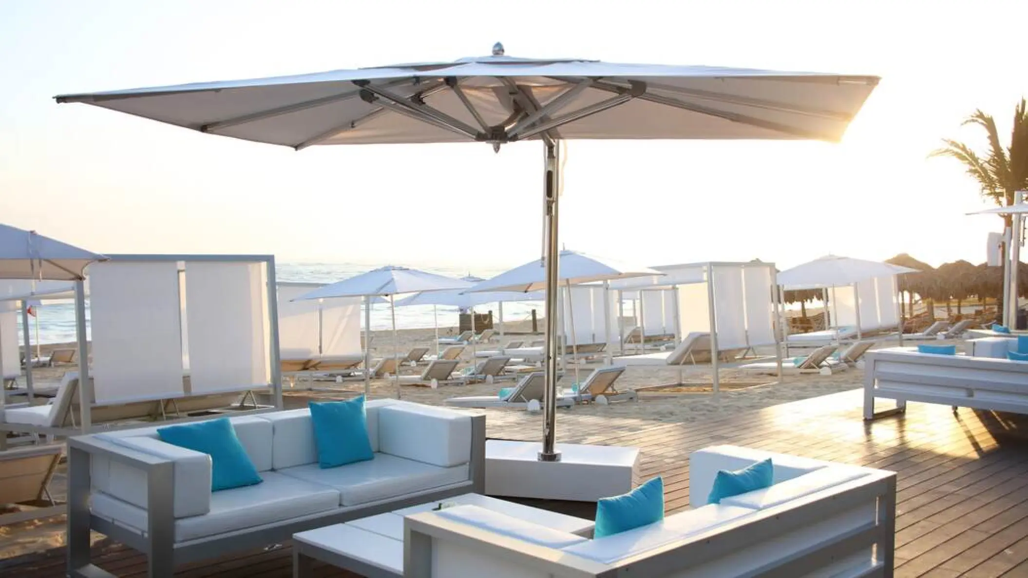 White lounge seating and cabanas on the beach at Iberostar Selection Bavaro, Punta Cana