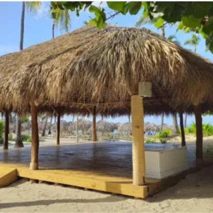 Large thatched-roof palapa yoga venue on the sand at Iberostar Selection Bavaro, Punta Cana