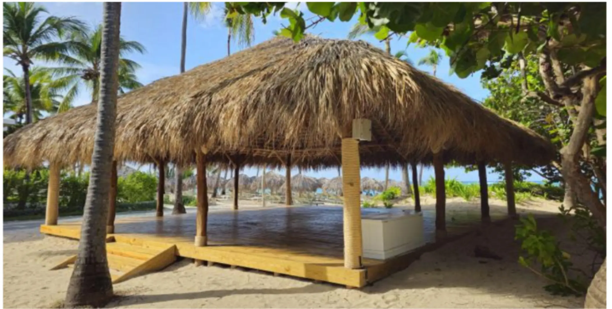 Large thatched-roof palapa yoga venue on the sand at Iberostar Selection Bavaro, Punta Cana