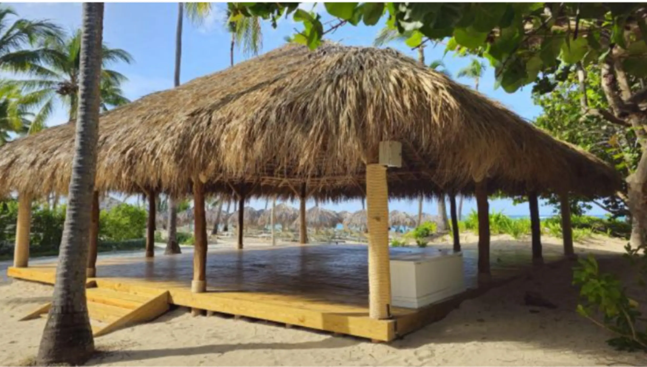 Large thatched-roof palapa yoga venue on the sand at Iberostar Selection Bavaro, Punta Cana