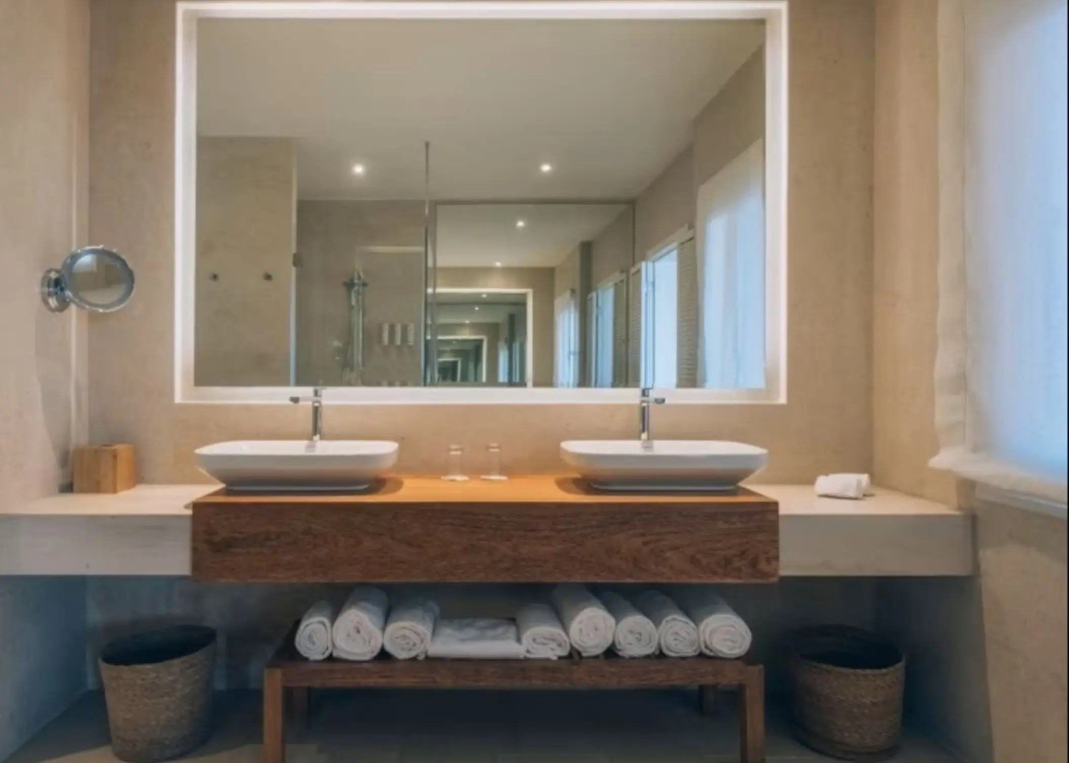 Modern suite bathroom with double vanity and large mirror at Iberostar Selection Bavaro, Punta Cana