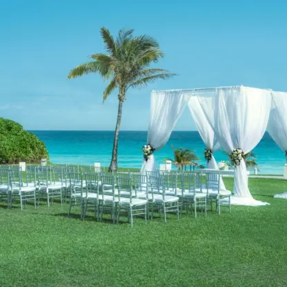 Garden wedding ceremony setup with white draped gazebo at Iberostar Selection Cancun, Cancun