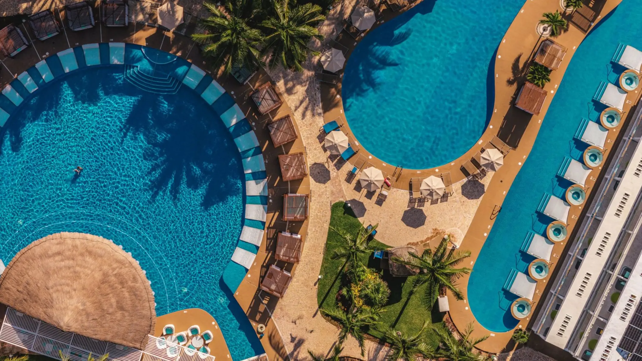 Aerial view of swimming pools and loungers at Iberostar Selection Riviera Cancun, Cancun