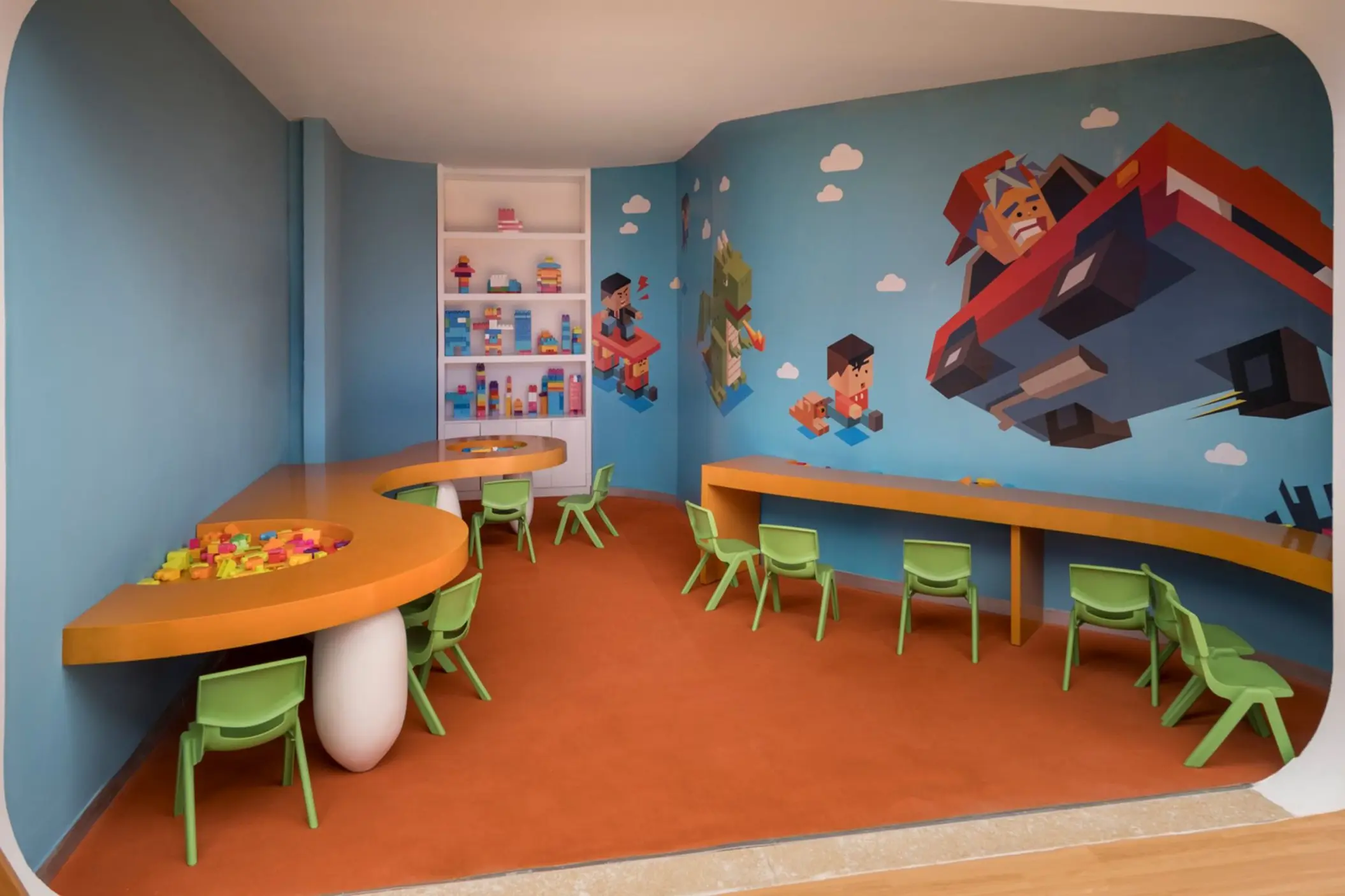 Kids club activity room with murals and small green chairs at Iberostar Selection Riviera Cancun, Cancun