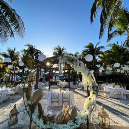 Outdoor wedding reception with a floral circular arch at Iberostar Selection Riviera Cancun, Cancun
