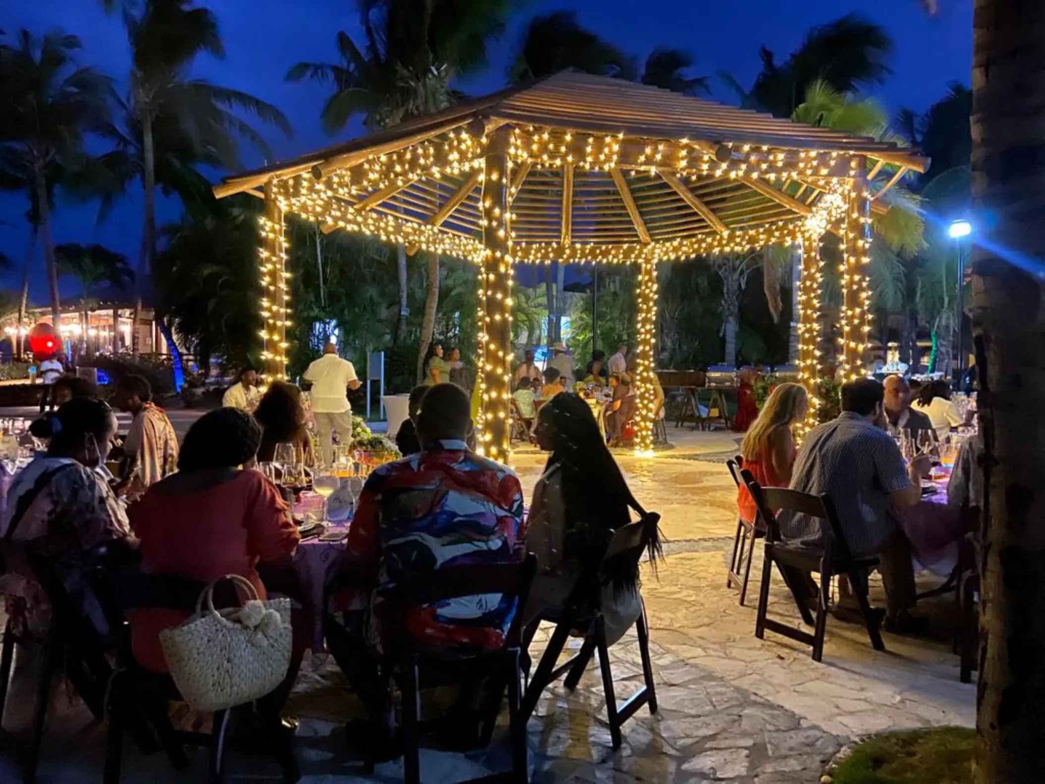 Outdoor wedding reception under a lighted gazebo at Iberostar Selection Riviera Cancun
