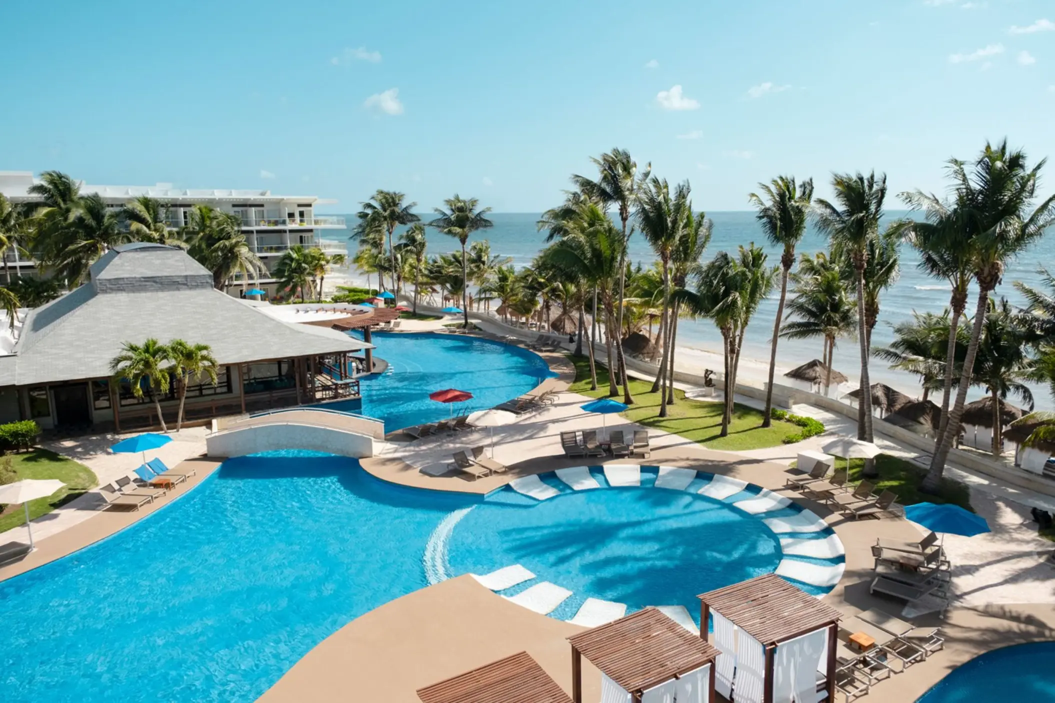 Aerial view of swimming pools and palm trees at Iberostar Selection Riviera Cancun
