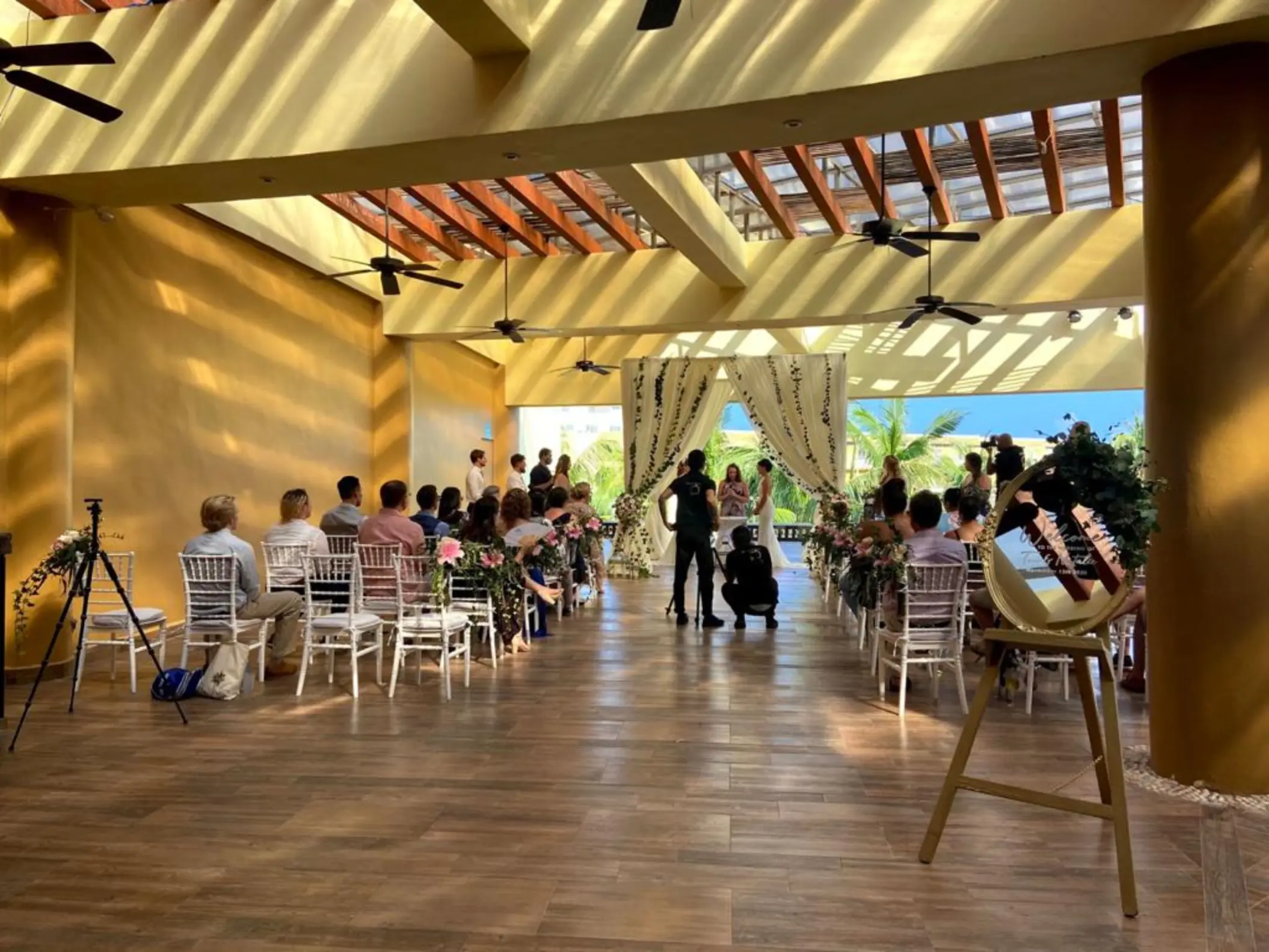 Indoor garden wedding ceremony under a pergola at Iberostar Selection Riviera Cancun