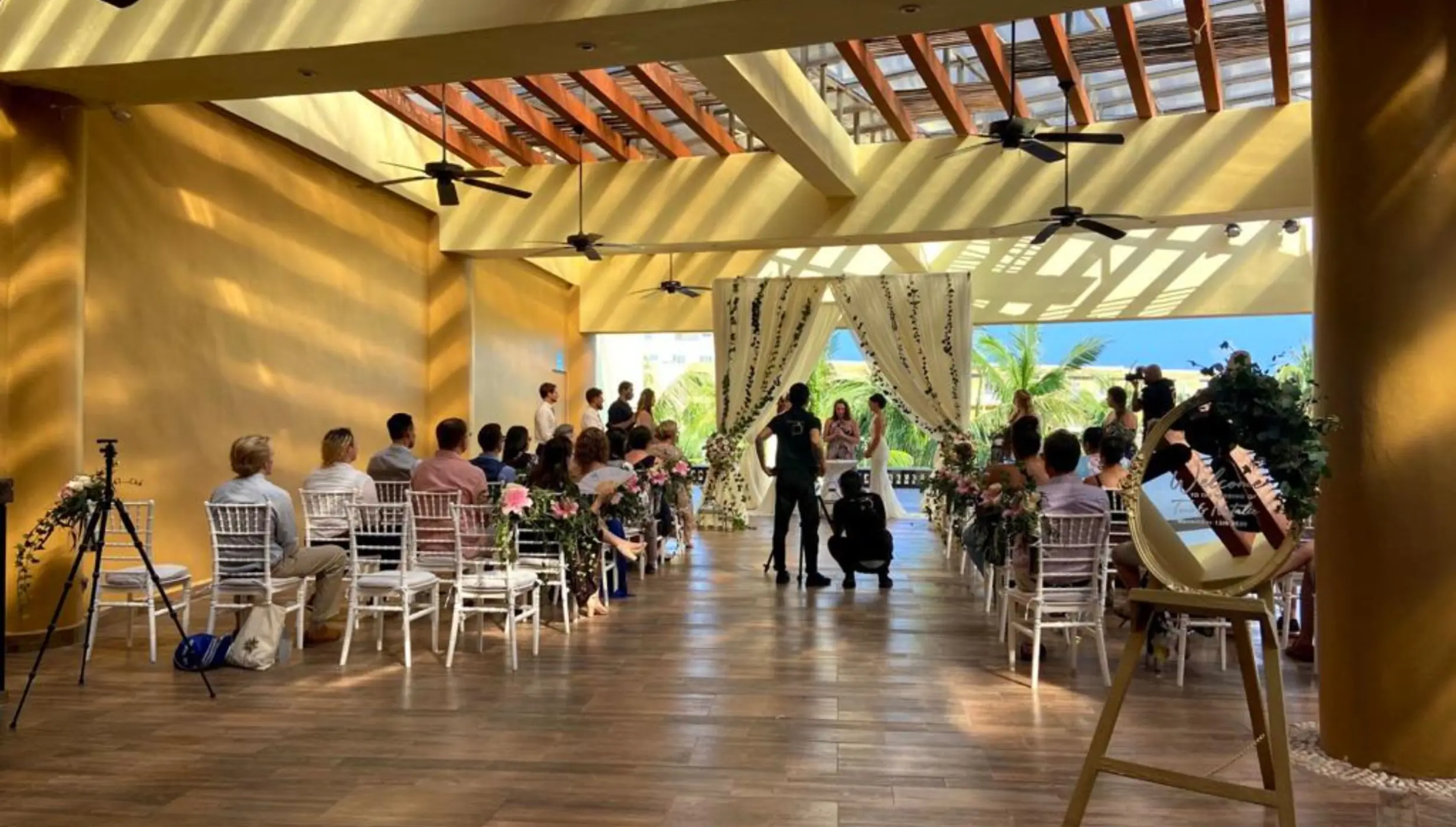Indoor garden wedding ceremony under a pergola at Iberostar Selection Riviera Cancun