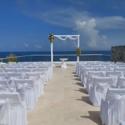 Rooftop wedding ceremony at Iberostar Selection Riviera Cancun with white seating and ocean views