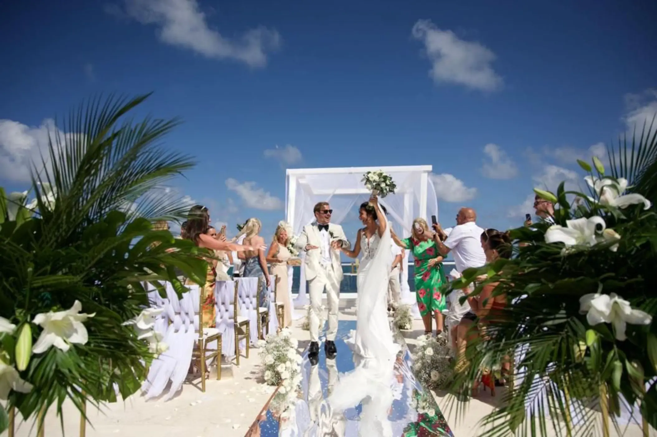 The bride and groom walking down the aisle at Iberostar Selection Riviera Cancun, Cancun