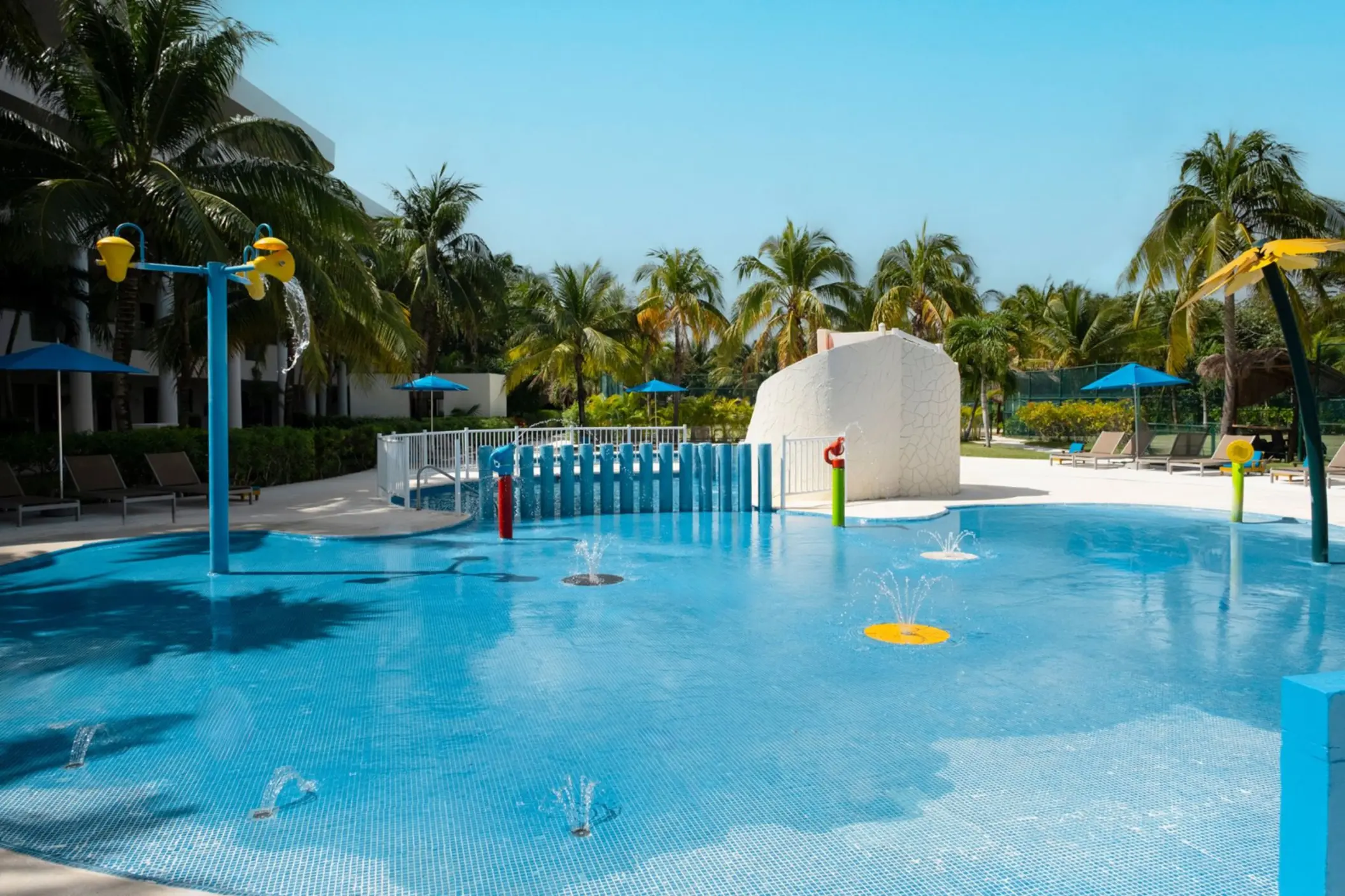 Children's splash pool with fountains and water slides at Iberostar Selection Riviera Cancun, Cancun