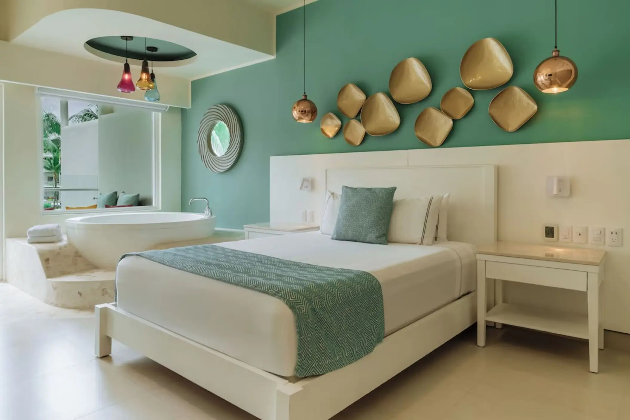 Modern suite with in-room soaking tub and green accent wall at Iberostar Selection Riviera Cancun, Cancun