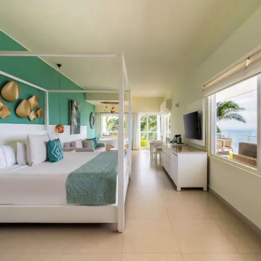 Iberostar Selection Riviera Cancun guest suite with canopy bed and ocean view, Cancun