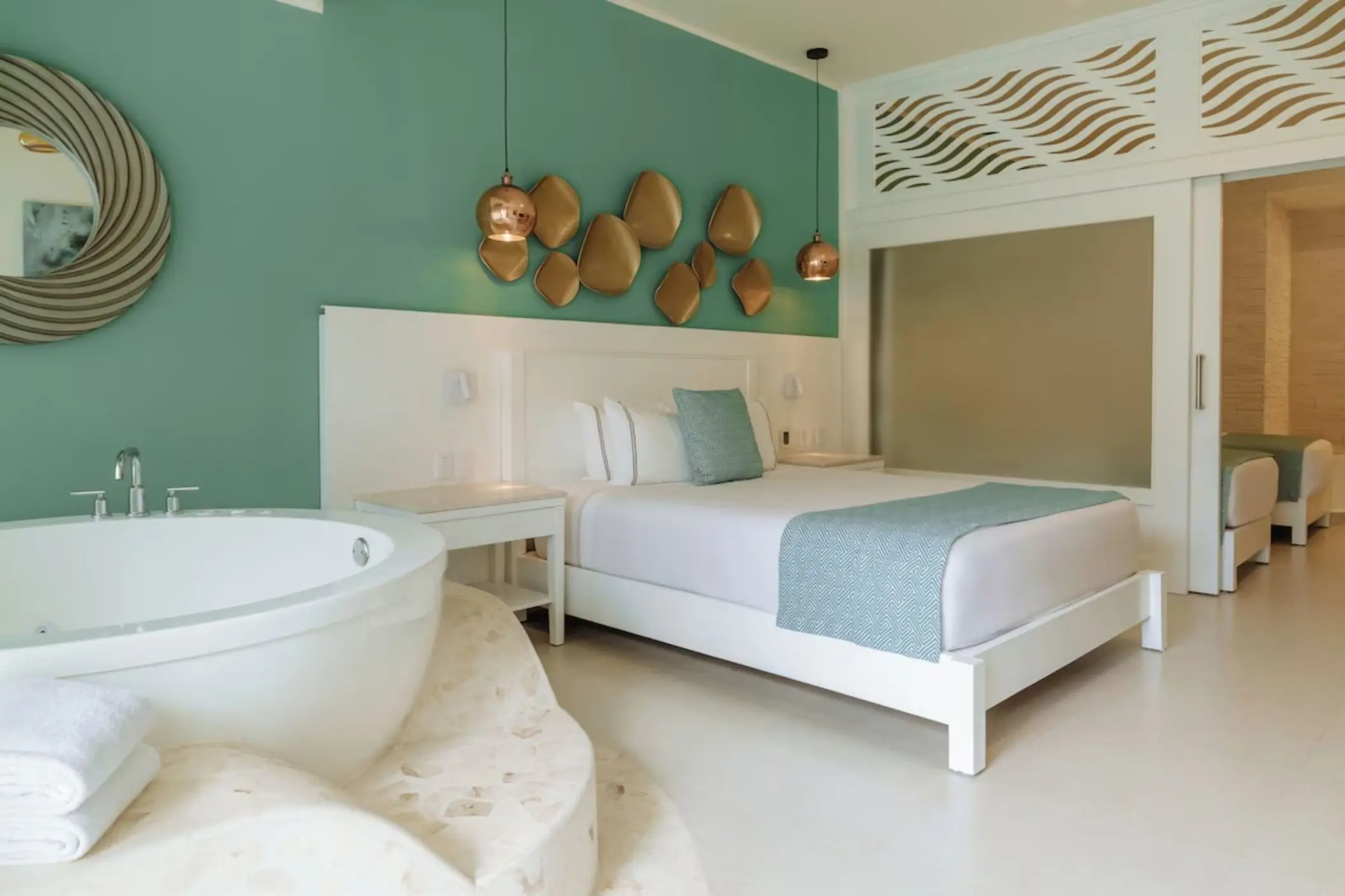 Iberostar Selection Riviera Cancun suite with a king bed and indoor jetted tub, Cancun