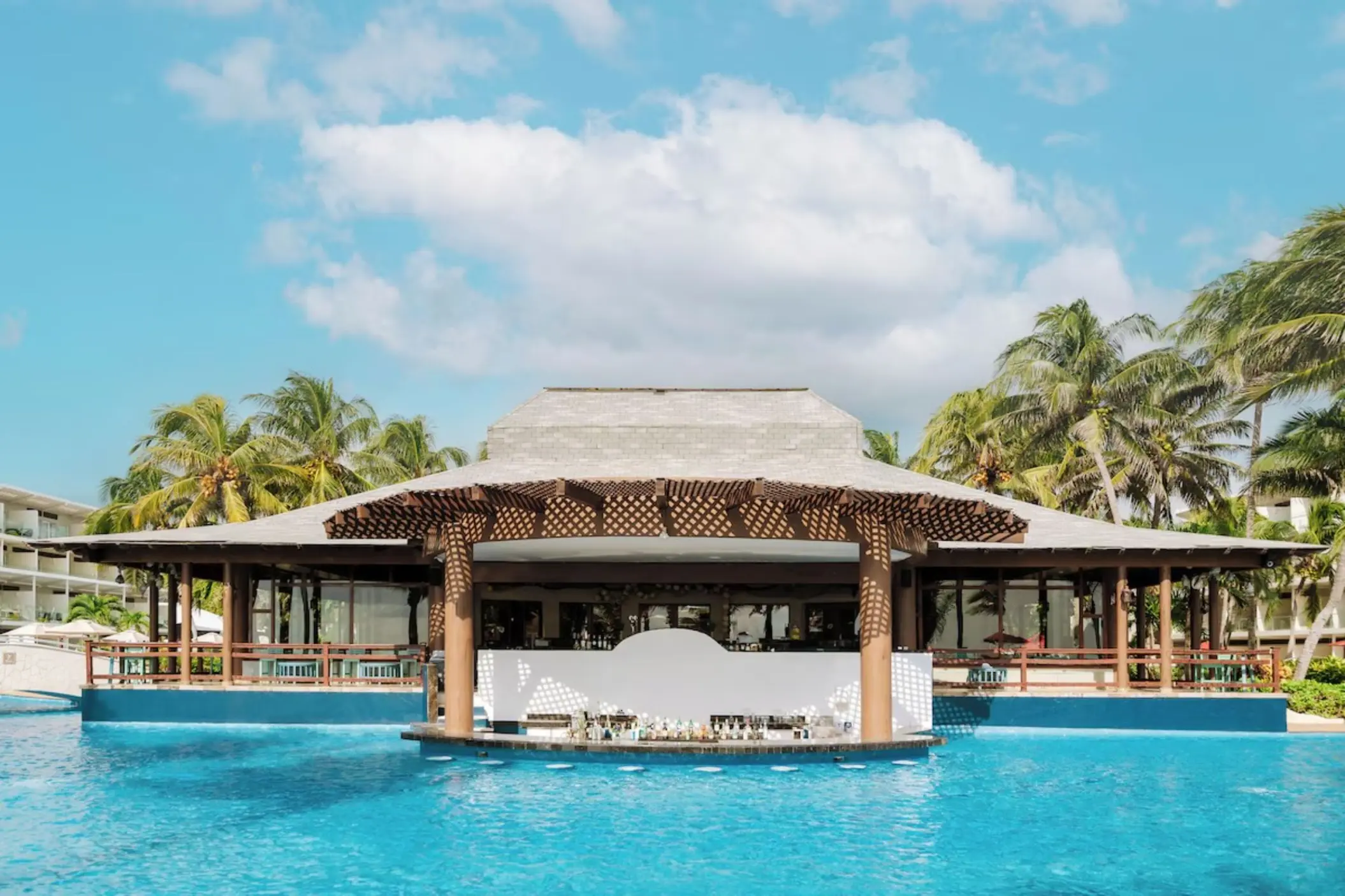 Swim-up bar with thatched roof at Iberostar Selection Riviera Cancun, Cancun